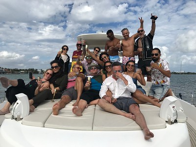 Group gathered on the bow during a Miami yacht outing