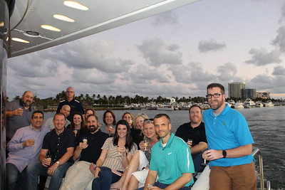 Guests enjoying drinks on an evening yacht charter